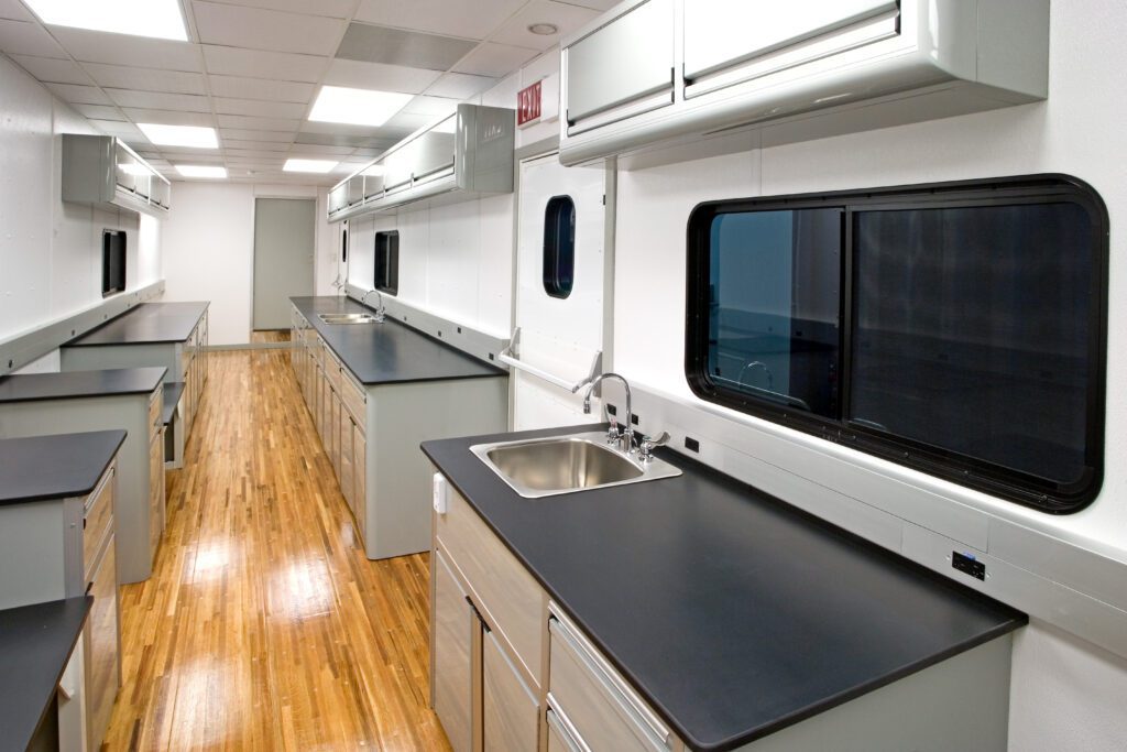 interior of the laboratory trailer, black counter tops and wooden floors