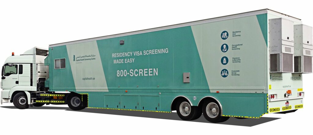 A teal-colored mobile screening truck with text advertising a screening service and a contact number on the side.